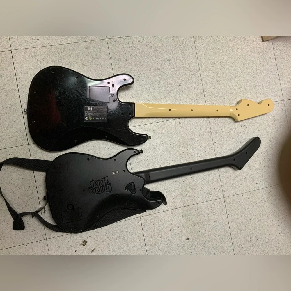 PS3 wireless Rock Band Harmonix & guitar Hero Guitars. One has cosmetic defects.